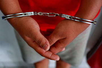 criminals, criminals whose hands are handcuffed, criminals arrested by police, Pekalongan Jawa...