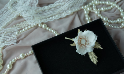 Wedding background with pearls and hair accessories on pink background