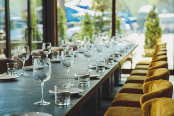 Glass goblets on the table. Served table. Table setting