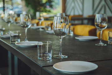Glass goblets on the table. Served table. Table setting