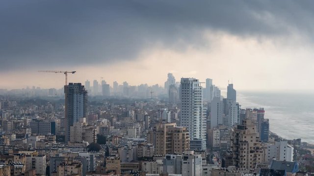 Cinemagraph of an Aerial view of a residential neighborhood in a city during a cloudy sunrise. Taken in Netanya, Center District, Israel. Still Image Continuous Animation