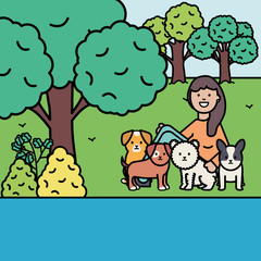 young woman with little dogs in the park