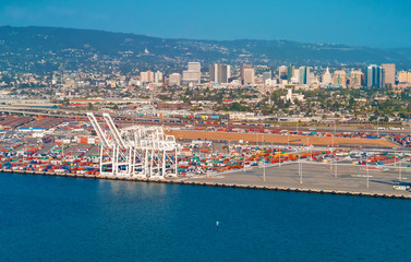 Fototapeta na wymiar Oakland Harbor port terminal with shipping containers and cranes