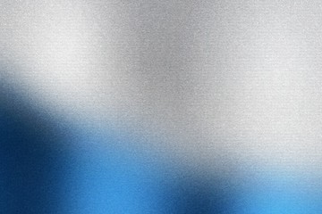 Glowing brushed blue and silver metal wall, abstract texture background