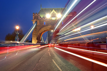 Fototapeta na wymiar Vehicles pass over Tower Bridge across the River Thames in London, UK.