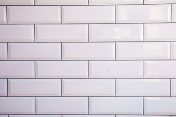 white brick wall of tiles