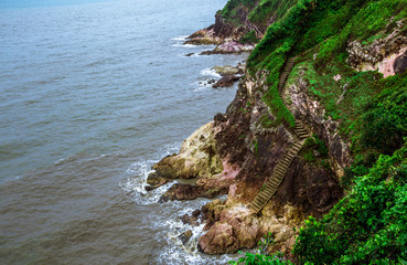 Blurred wallpaper of nature by the sea, with the wind blowing through, rain storms passing through,...