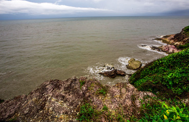 Blurred wallpaper of nature by the sea, with the wind blowing through, rain storms passing through, the sky has black clouds covered, is a natural event