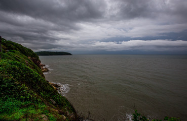 Blurred wallpaper of nature by the sea, with the wind blowing through, rain storms passing through, the sky has black clouds covered, is a natural event