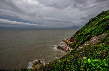 Blurred wallpaper of nature by the sea, with the wind blowing through, rain storms passing through, the sky has black clouds covered, is a natural event