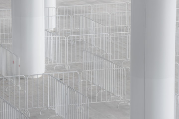 Portable metal fences of white color for the obstruction of the territory and organization of the queue for the event