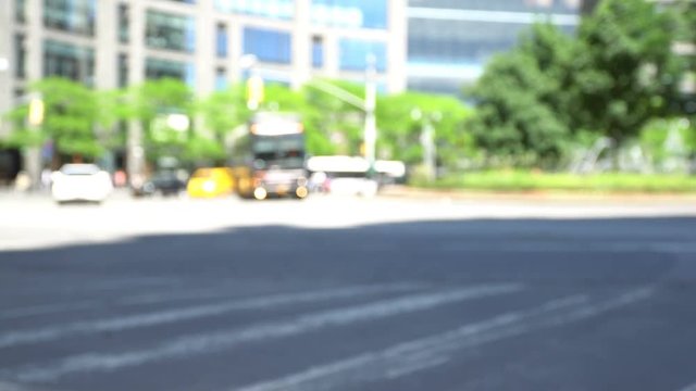 Blurred Columbus Circle Traffic video background, yellow cabs, cars, cyclists and public transport shot on a sunny morning in New York near Central Park