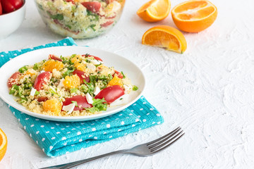 Healthy and simple food, light summer lunch, fragrant salad with couscous and oranges