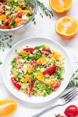 Healthy and simple food, light summer lunch, fragrant salad with couscous and oranges