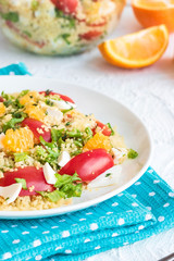 Healthy and simple food, light summer lunch, fragrant salad with couscous and oranges