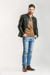 Handsome stylish man on light background