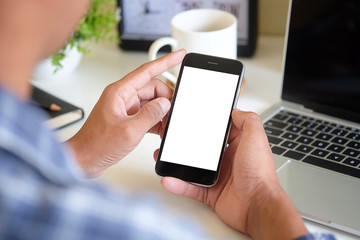 Cropped shot view of man hands holding smart phone with blank copy space screen for your text message or information content, female reading text message on cell telephone during in urban setting. 