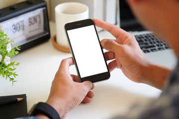 Cropped shot view of man hands holding smart phone with blank copy space screen for your text message or information content, female reading text message on cell telephone during in urban setting. 