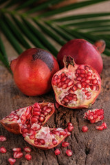 Ripe pomegranate fruit on wooden  background. - Image