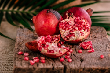 Obraz na płótnie Canvas Ripe pomegranate fruit on wooden background. - Image