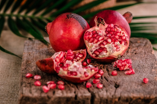 Ripe pomegranate fruit on wooden  background. - Image