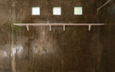 Fototapeta na wymiar concrete wall with shelf for background