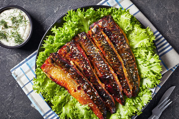 roasted fillets of mackerel fish with lettuce