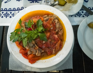 National Georgian dish of lamb served in a white plate in an ethnic restaurant. Food for gourmets 