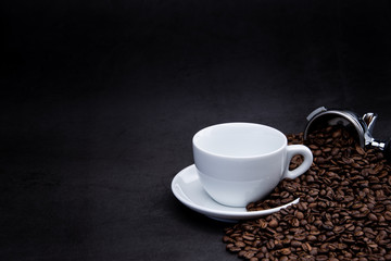 cup of coffee with beans and coffee machine on black background
