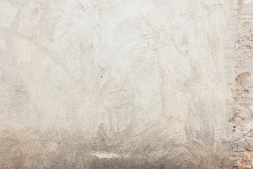 Texture of a concrete wall with cracks and scratches which can be used as a background