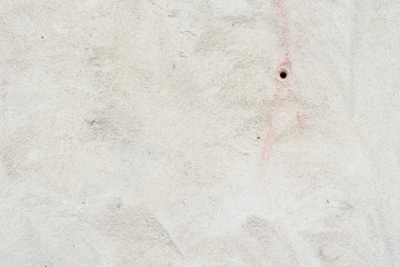 Texture of a concrete wall with cracks and scratches which can be used as a background