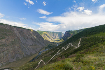 Valley of the river, top view. Altay mountains. Summer sunny day. Mountain car pass