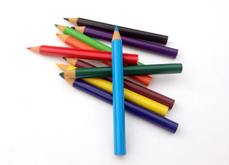 many different colored pencils on a white background.