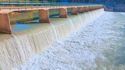 Water spills over the top of Silifke Dam on the Goksu River