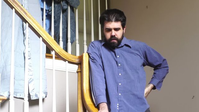 desheveled man inside house