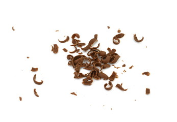 Obraz premium Grated chocolate. Heap of ground chocolate isolated on white background with clipping path, closeup.