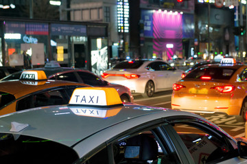  Neons, lights and Taxis waiting for customers, night urban scene on Gangnam Daero Avenue, Seoul,...