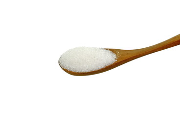 Heap of granulated sugar in a spoon isolated on white background.