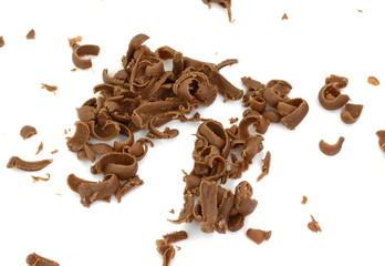 Grated chocolate. Heap of ground chocolate isolated on white background with clipping path, closeup.