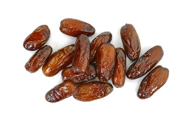 Dried dates over white background. Heap of dried dates isolated on white background.