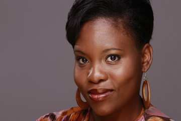 head shot of pretty black young woman smiling 