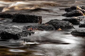Long Exposure Stream Rapids and Rocks in the Fall