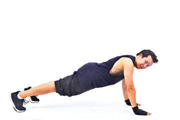 Fototapeta na wymiar Portrait of sport young man doing Full Plank Workout ,studio shot on a white background