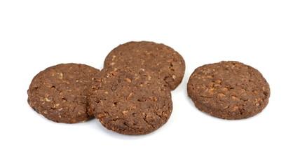 Round chocolate whole wheat biscuit, cookie with raisins isolated on white background. Chocolate Biscuits with whole-wheat (wholemeal) flour isolated on white background 