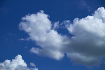 Naklejka na ściany i meble background white clouds on blue sky