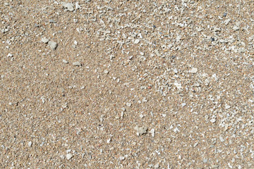 Sand on the coast of the sea close up. Natural abstract background