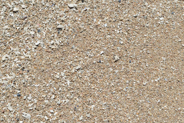 Sand on the coast of the sea close up. Natural abstract background