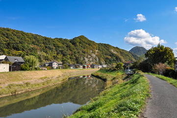 Fototapeta na wymiar Pathway go to a mountain beside a stream in Tottori prefecture, JAPAN.
