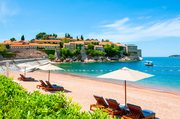 Sveti Stefan island with beautiful beach near Budva, Montenegro. Luxury resort at Adriatic sea....