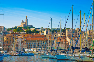 View of Marseille harbor with the famous church of Notre Dame de la Garde on background...